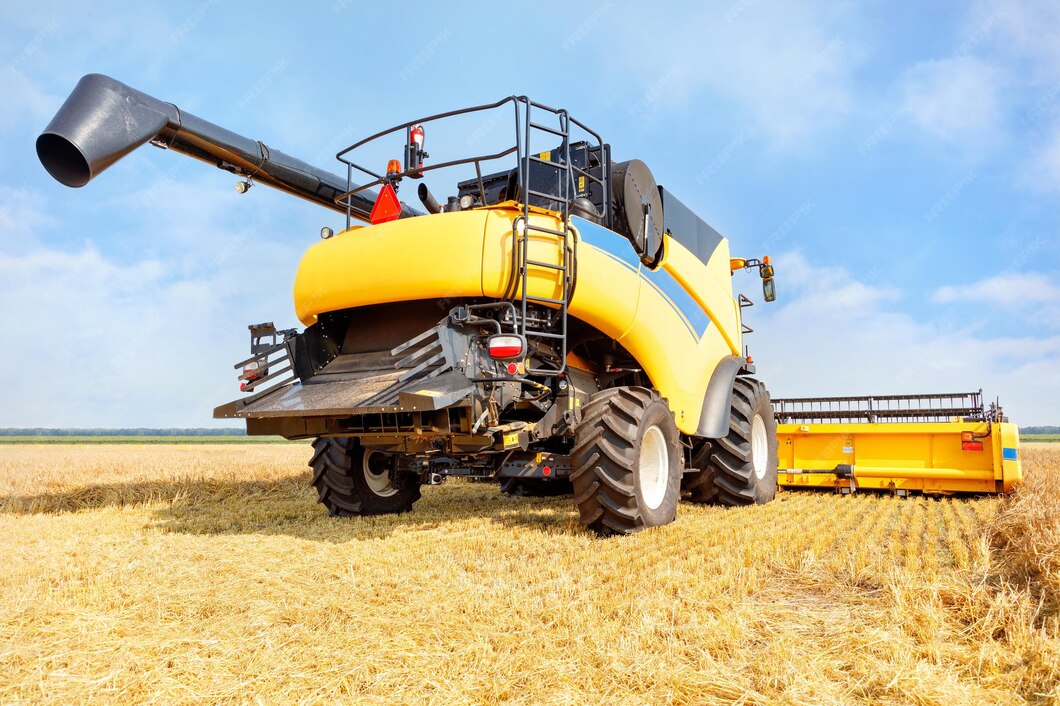 large-yellow-agricultural-harvester-harvesting-crops-against-backdrop-wheat-field-day_1048944-15774701