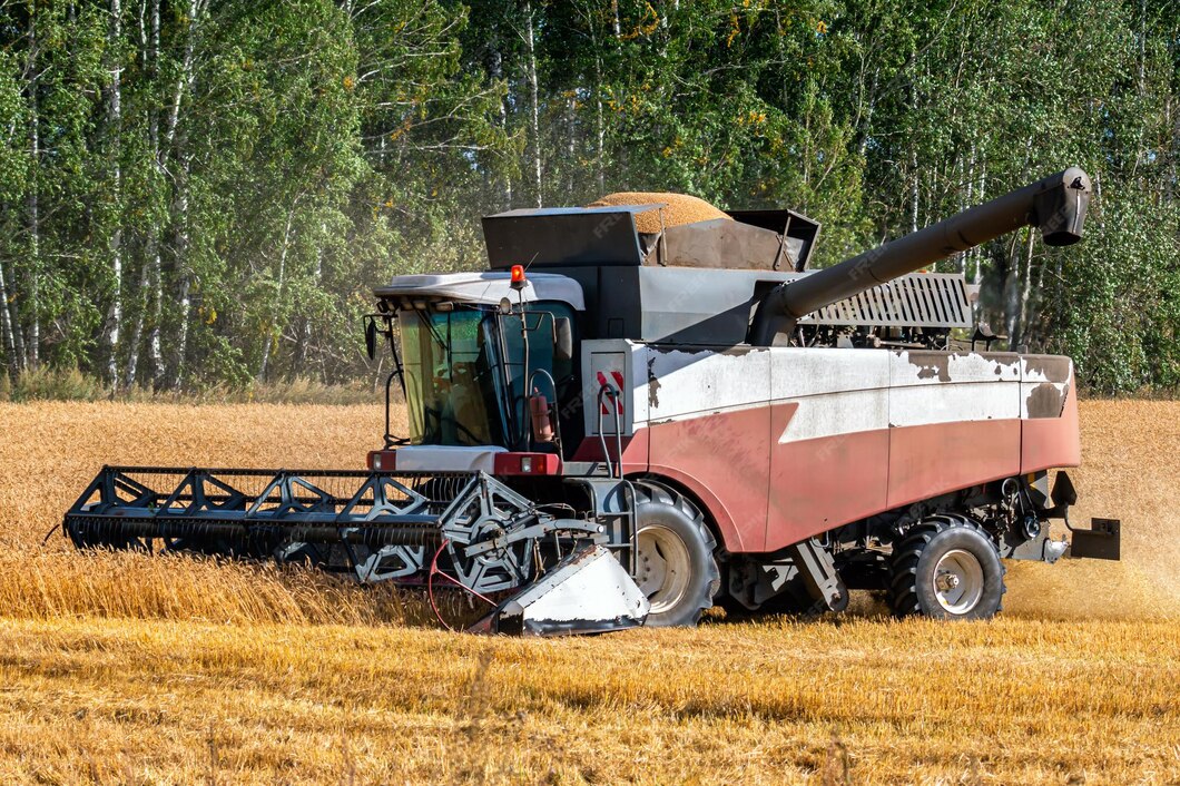 modern-combine-harvester-working-field-clear-sunny-day_527900-1488